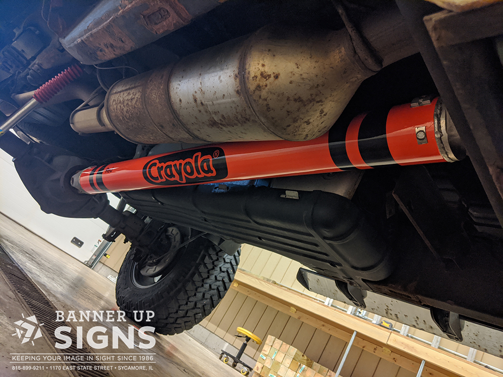 Personalize your vehicle with a custom driveshaft wrap from Banner Up Signs!