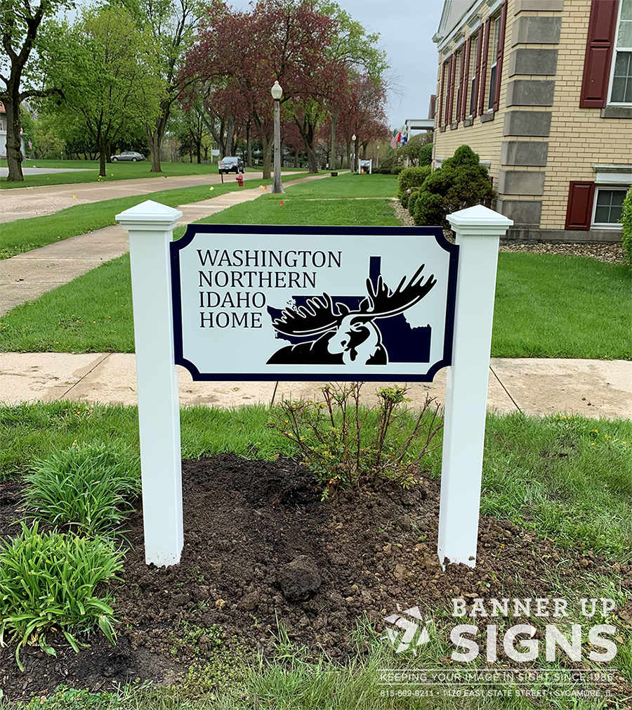 A custom shaped post sign with non dimensional graphics were produced and installed by Banner Up Signs for Washington Northern Idaho Home.