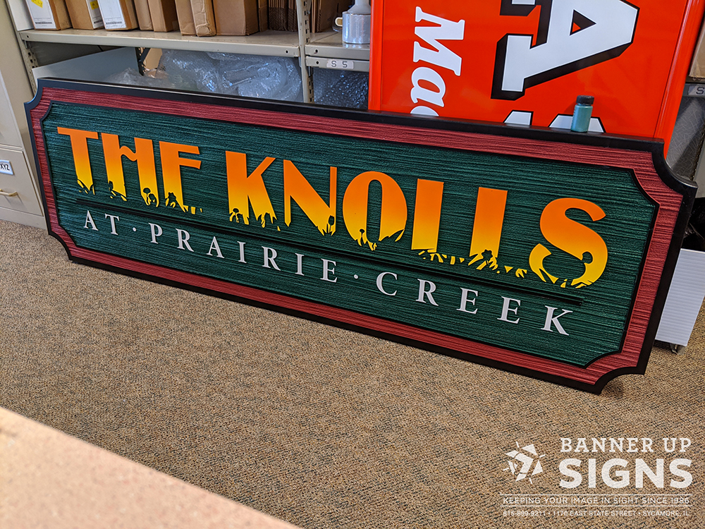 A routed and painted HDU sign created for The Knolls