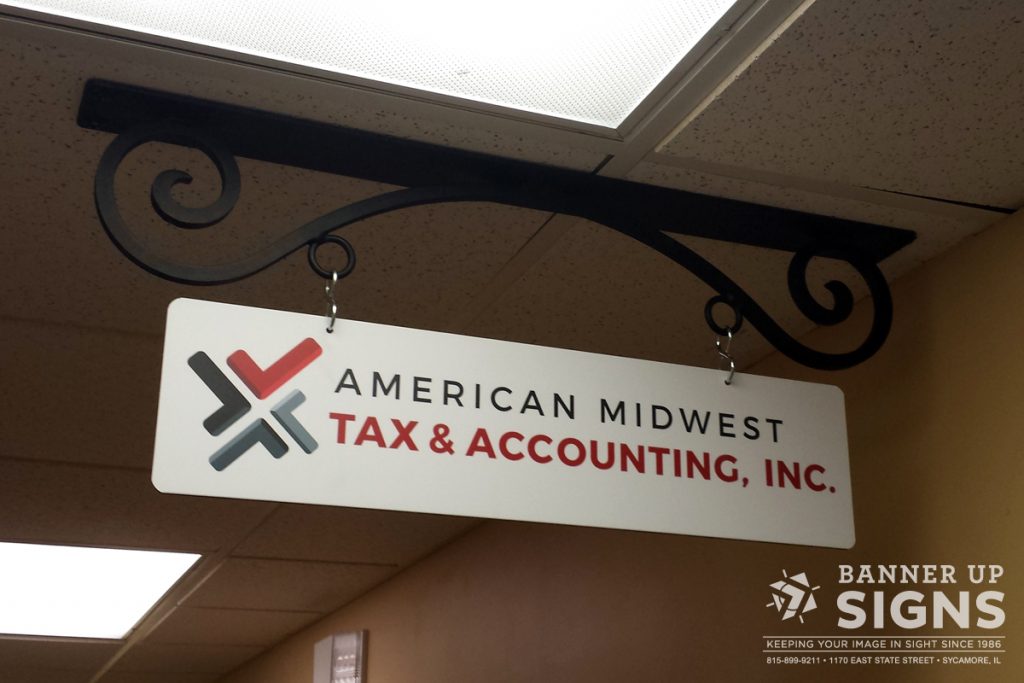 Decorative hanging sign, with a client's logo for easy identification in an interior building.