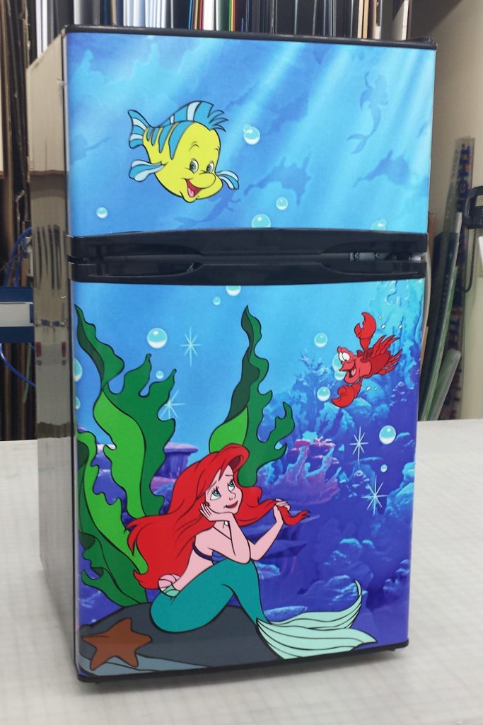 Personalized graphic fridge wrap created by Banner Up Signs for a mini refrigerator