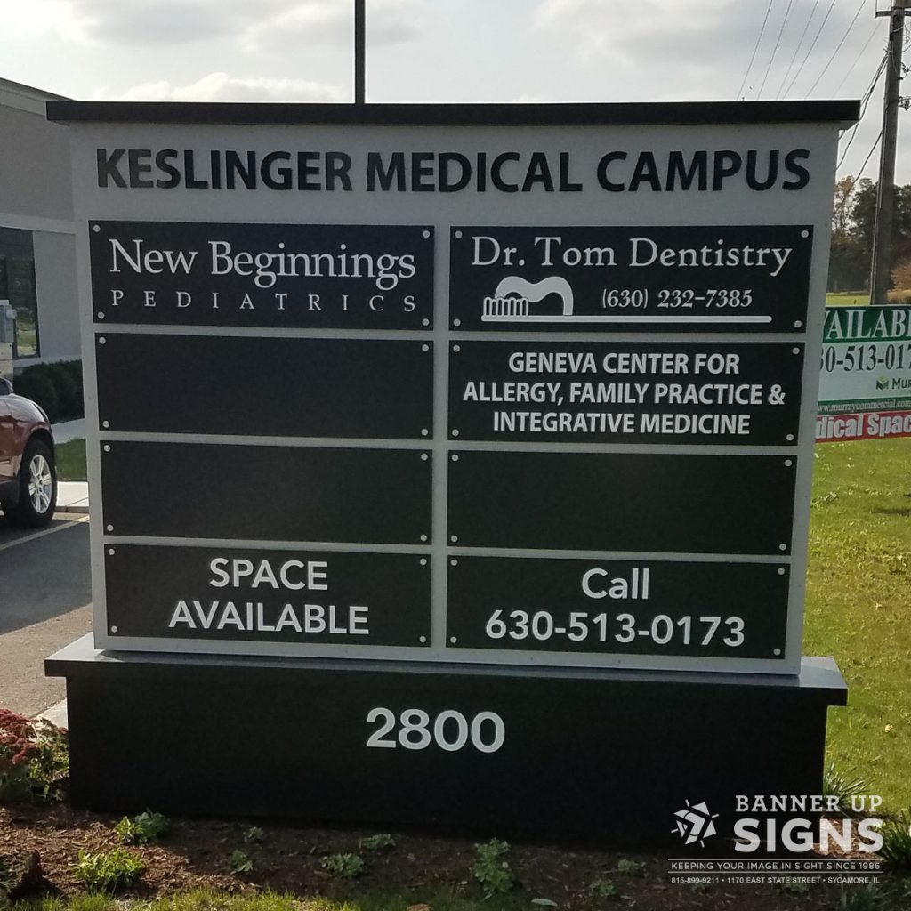 A road sign for Keslinger Medical Campus lists the medical offices in each suite of the building.